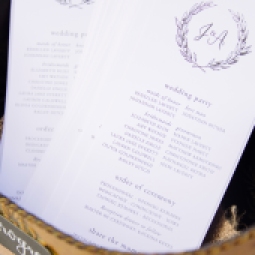 - AMY ROCHELLE PRESS - Wedding program with crest / olive wreathe monogram. Photography: Images by Bethany.