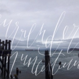 - AMY ROCHELLE PRESS - "Surrender in Uncertainty." Wispy hand lettering / modern calligraphy over the Pacific Northwest Coastline.