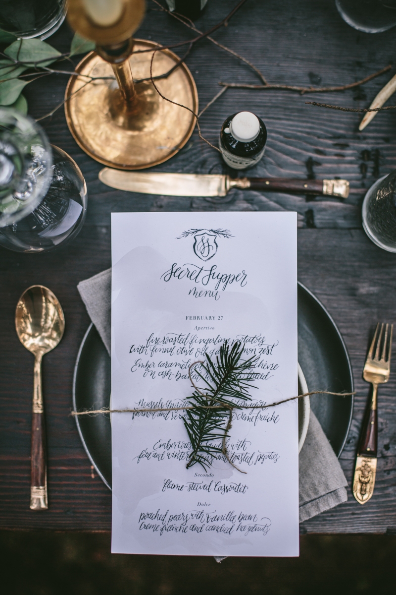 - AMY ROCHELLE PRESS - Fire and Ice Secret Supper. Hand lettered menus with taupe watercolor washes and a simple pine crest. Photo by Eva Kosmas Flores